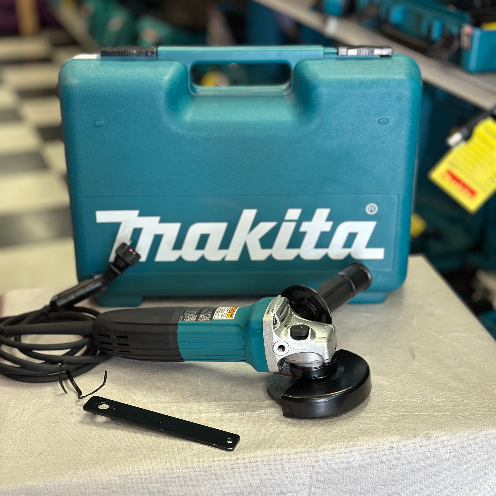 Makita 6 Amp Corded 4 in. Lightweight Angle Grinder with Grinding Wheel, Wheel Guard Side Handle Hard Case