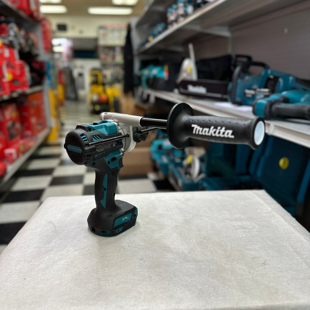 Rear side of Makita drill driver with side handle