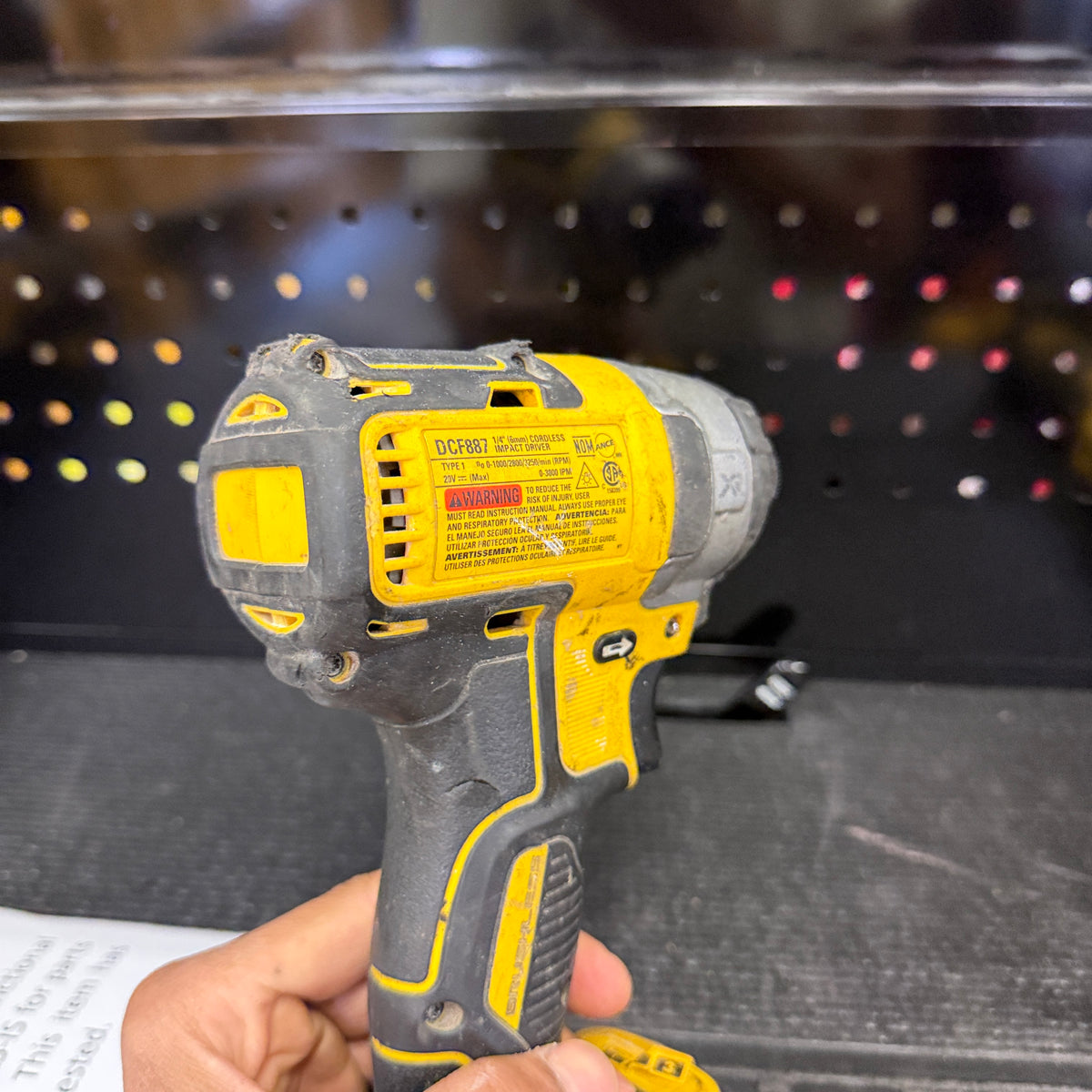 DEWALT DCF887 impact driver with For Parts Only sign