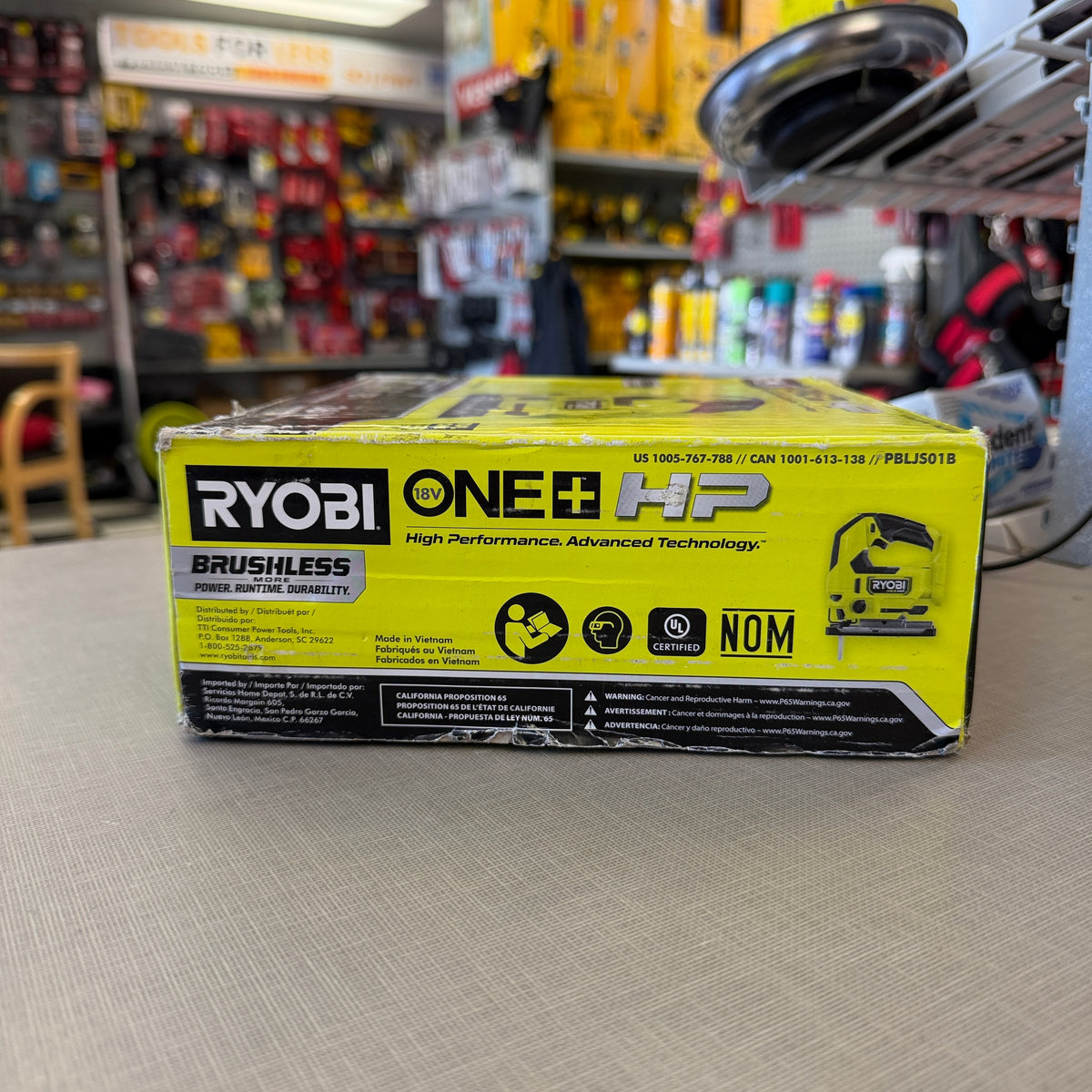 Side of RYOBI PBLJS01B ONE+ HP brushless jig saw box showing model number and UL certification