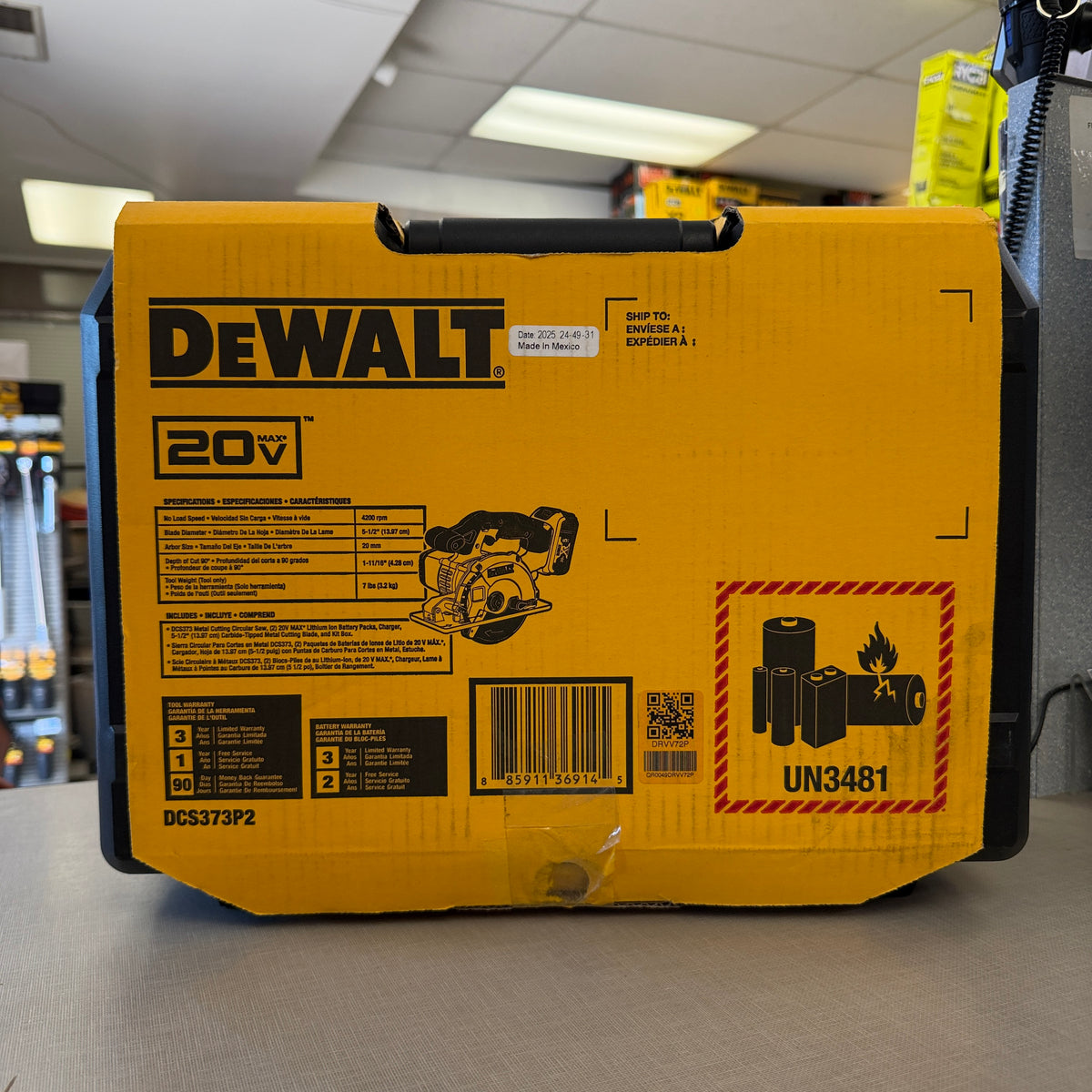 DEWALT DCS373P2 box label showing 5-1/2 inch blade, 4200 RPM specs and kit contents
