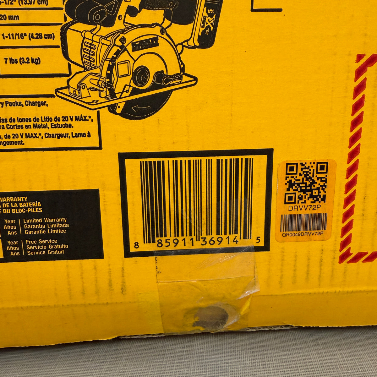 Close-up of DEWALT DCS373P2 kit box specifications and warranty label